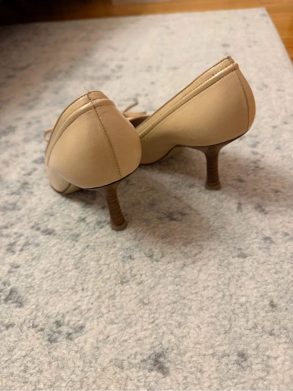 CHANEL Beige Pointed-Toe Leather Pumps with Bow and CC Charm